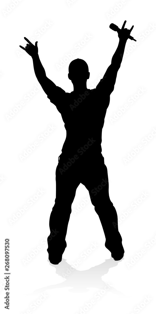 A singer pop, country music, rock star or hiphop rapper artist vocalist singing in silhouette