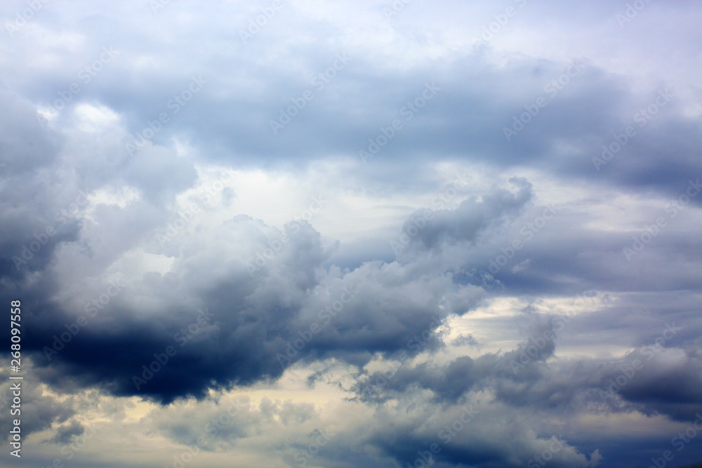 Gray rainy sky with big clouds. Nature background. Gray rainy sky with big clouds. Nature background.