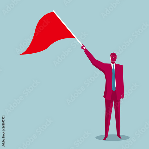 Businessman holding a signal flag. Isolated on blue background.