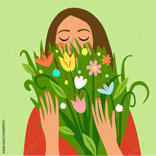 Happy girl holding a bouquet of flowers