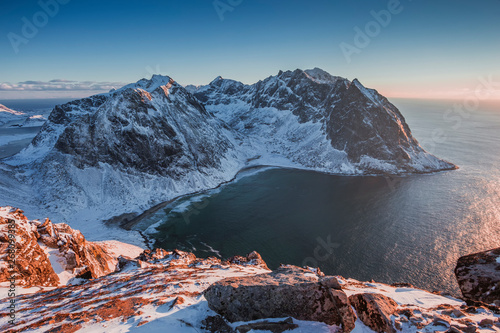 Winter landscape of high mountains and the sea from the top of the mountain Ryten