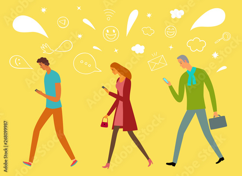 People walking and  looking on their phones.