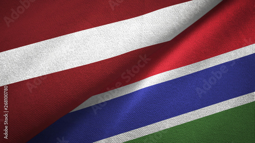 Latvia and Gambia two flags textile cloth, fabric texture