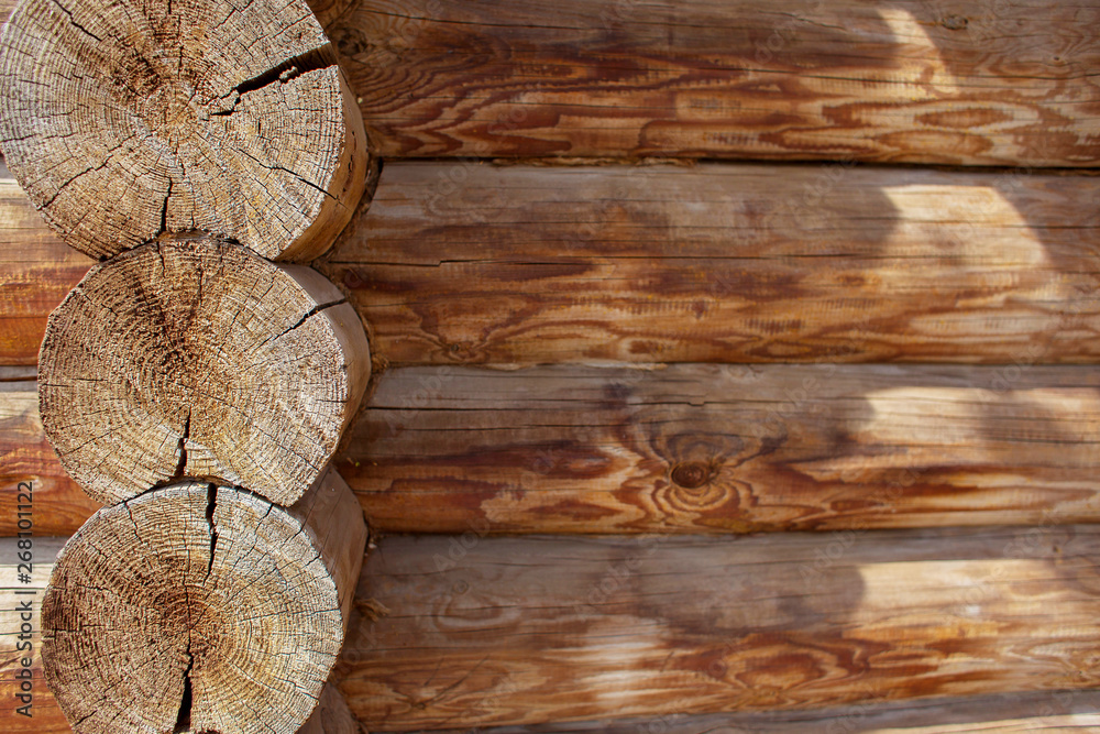 Wooden texture, log hut from logs, a felling, the place for an inscription, space for text, copyspace Wooden texture, log hut from logs, a felling, the place for an inscription, space for text, copyspace