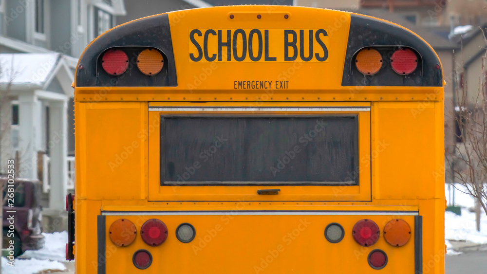 Clear Panorama Yellow school bus with rectangular window and several signal lights at the rear