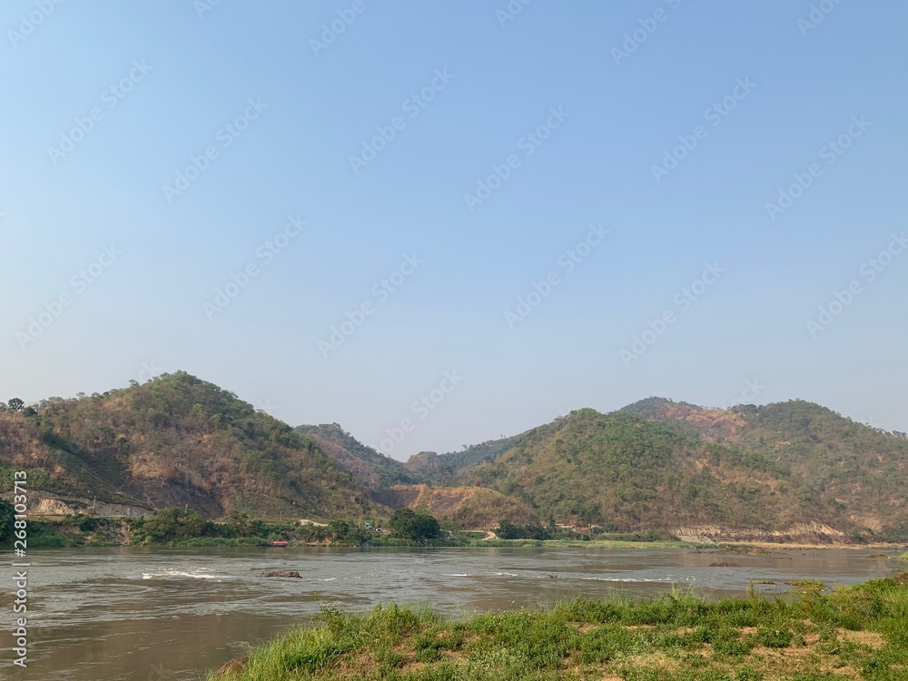 Natural scenery photos of the mountain, river and bright sky as beautiful background