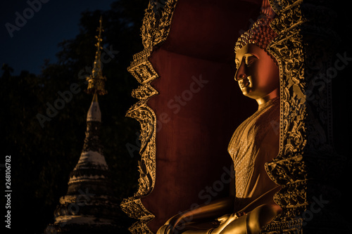Buddha Statue Near Stupa at Night