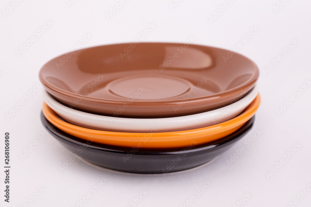 Fours plates of black, white, orange and brown colors, isolate Fours plates of black, white, orange and brown colors, isolate