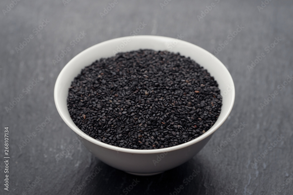 seeds of black sesame in the white bowl seeds of black sesame in the white bowl