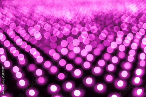 Abstract bokeh background. Soft defocused lights. Neon basic pink color