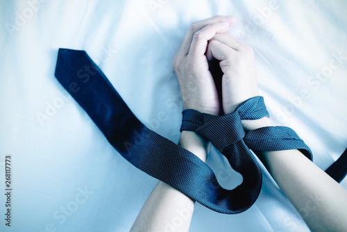 man tied up with a necktie