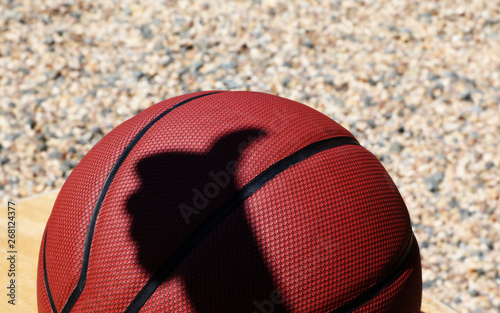 Basketball man hand shadow stone background 