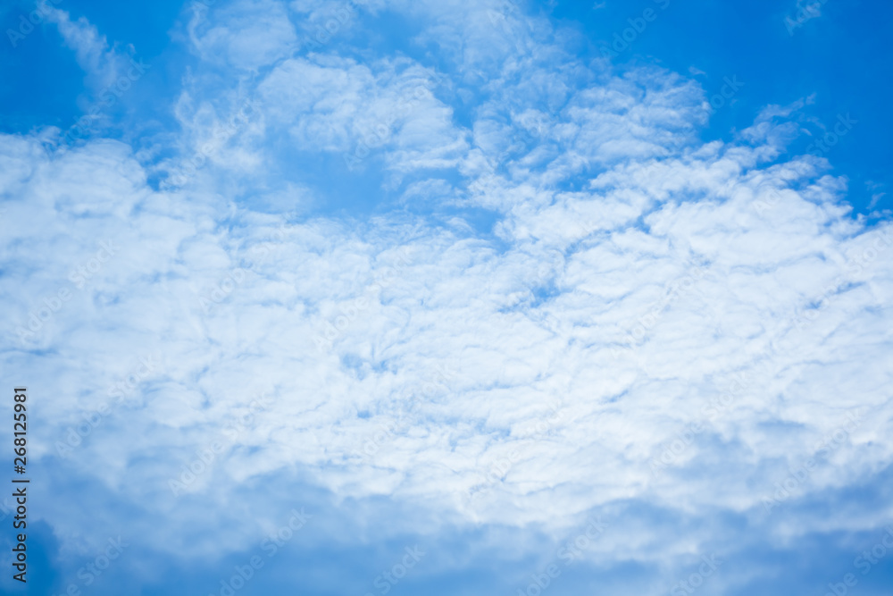 Cirrus clouds against the dark blue sky. Heavenly background. Pattern of clouds in the blue sky, blue sky with cloud