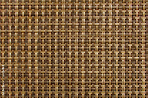 Interlaced checkered pattern of brown and beige lines. rough surface texture