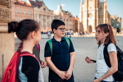 Kids hang out on town square after school