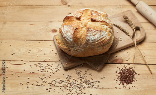 Freshly baked bread on wooden background. Bread at leaven. Unleavened bread.