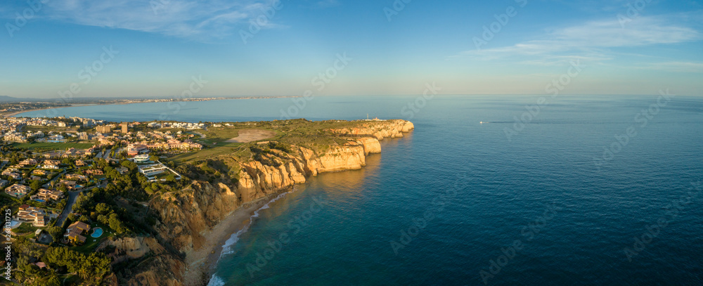 Aerial Scenic seascape, of Ponta da Piedade promontory (cliff formations along coastline of Lagos city), natural landmark destination, Algarve. South Portugal.