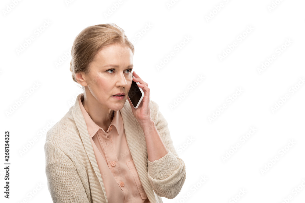 concentrated middle aged woman talking on smartphone Isolated On White concentrated middle aged woman talking on smartphone Isolated On White