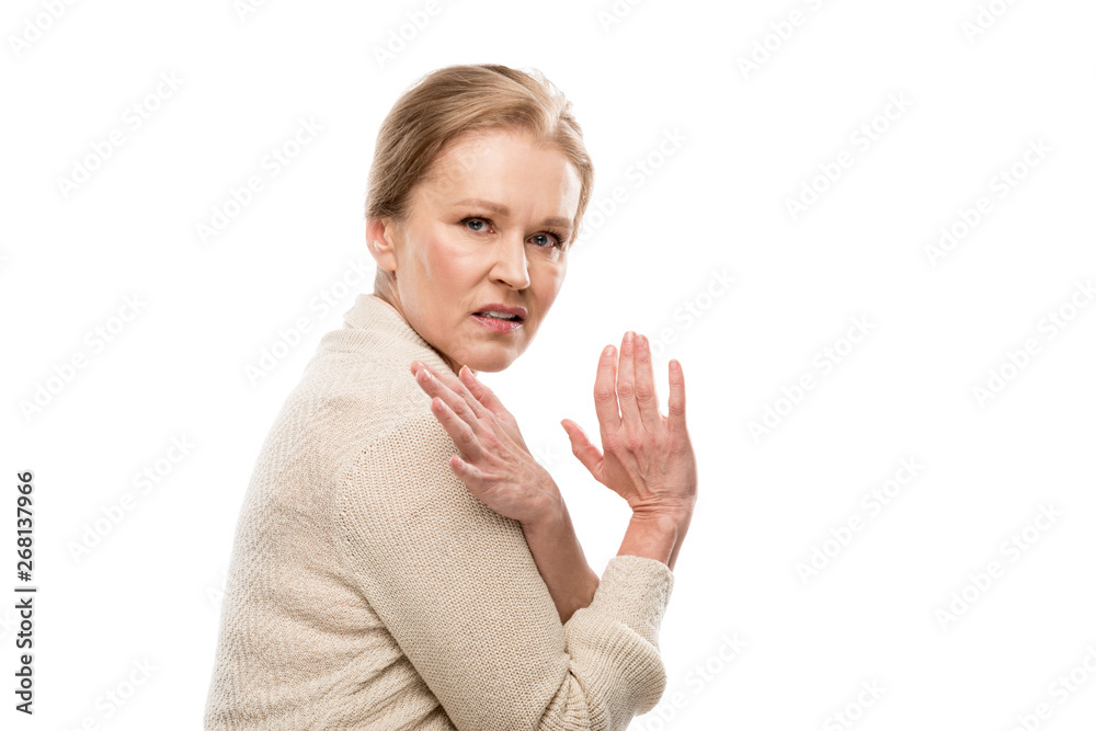 scared middle aged woman looking at camera and Gesturing with hands Isolated On White scared middle aged woman looking at camera and Gesturing with hands Isolated On White