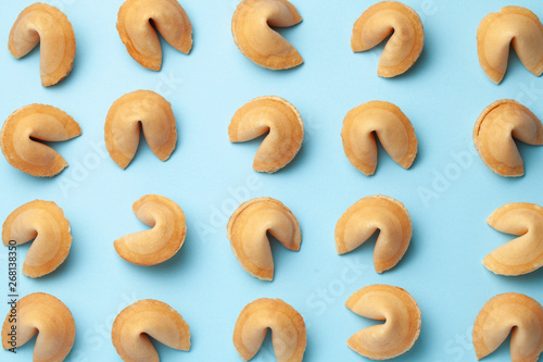 Chinese fortune cookies. Cookies texture pattern with empty blank inside for word prediction. Blue background.