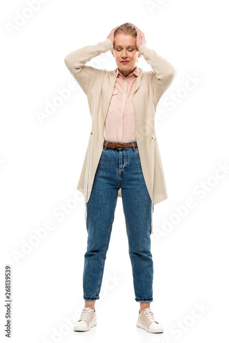 middle aged woman with hands on head having headache Isolated On White