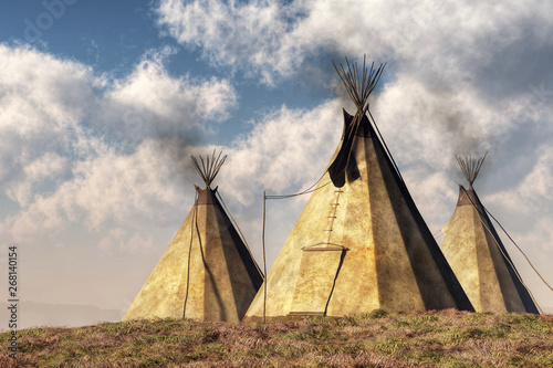 Three teepees (also called tipis or tepees) which are Native American tents, stand on a grassy hill in the plains of the American west. 3D Rendering   © Daniel Eskridge