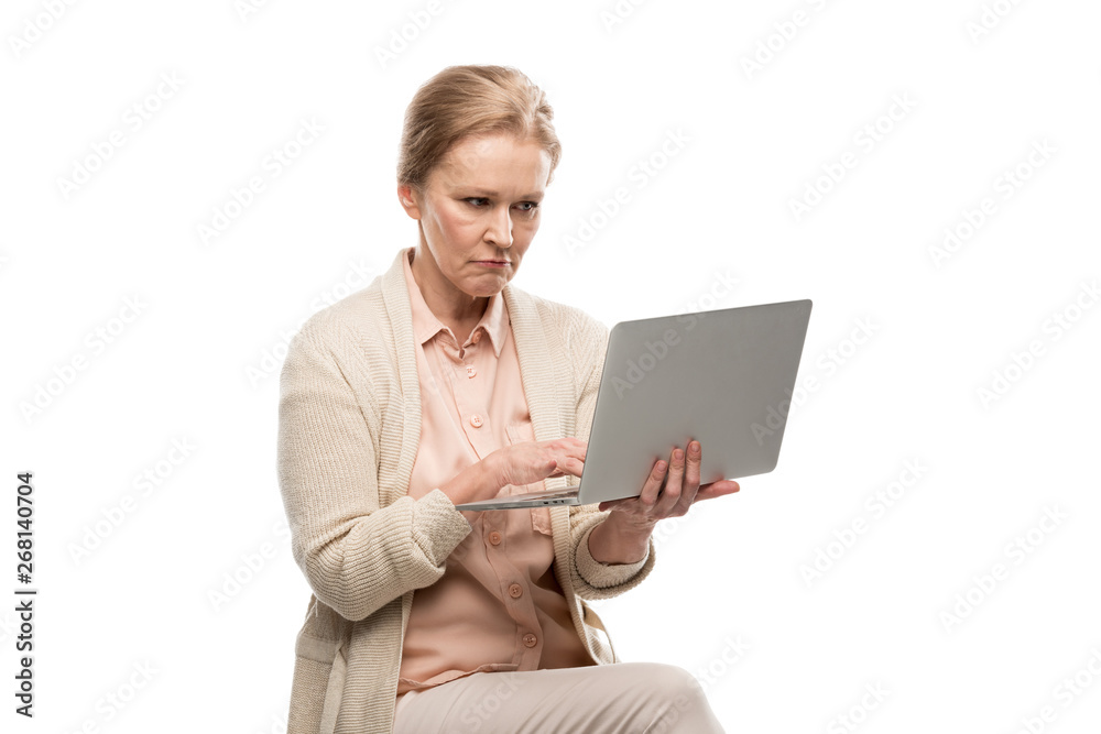 confused middle aged woman using laptop Isolated On White confused middle aged woman using laptop Isolated On White