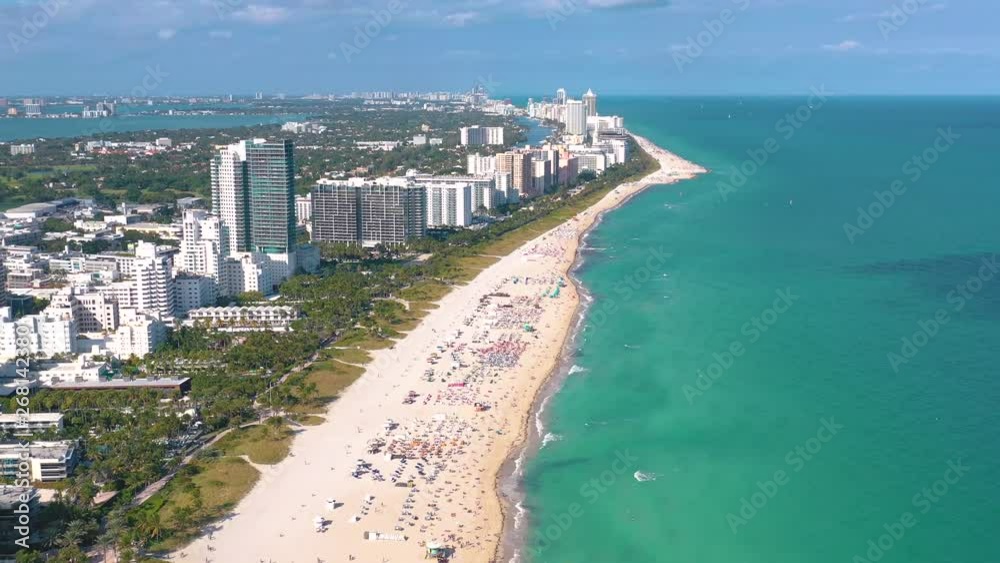 MIAMI, FLORIDA, USA - MAY 2019: Aerial drone panorama view flight over Miami beach. South Beach sand and sea from above. MIAMI, FLORIDA, USA - MAY 2019: Aerial drone panorama view flight over Miami beach. South Beach sand and sea from above.