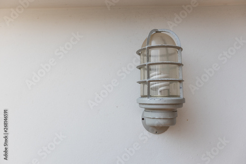 Wall lamp outdoor on white wall background.