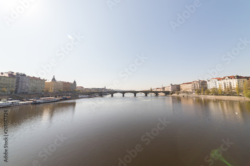 Charles Bridge in a daylight. Sailing on a river