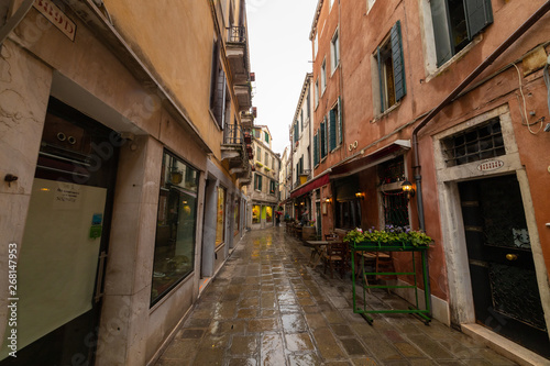Italian streets. Old walls made of bricks. Local cafes © KONSTANTIN SHISHKIN