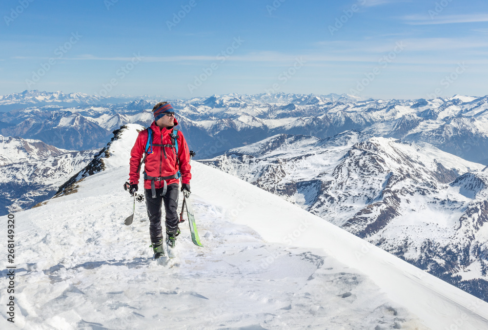 Male touring skier in the mountains