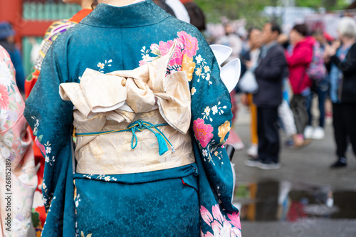 Young girl wearing Japanese kimono standing in front of Sensoji Temple in Tokyo, Japan. Kimono is a Japanese traditional garment. The word "kimono", which actually means a "thing to wear" © zasabe