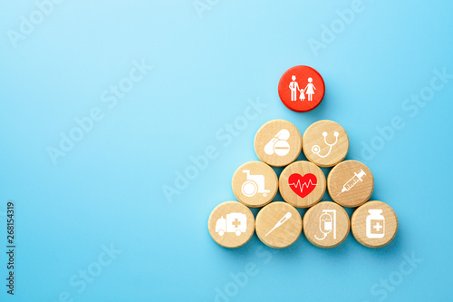 Fotografie Health insurance concept, wooden blocks with healthcare medical icon, blue backg