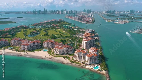 MIAMI, FLORIDA, USA - MAY 2019: Aerial drone view flight over Miami beach. South Beach and Fisher island from above. photo