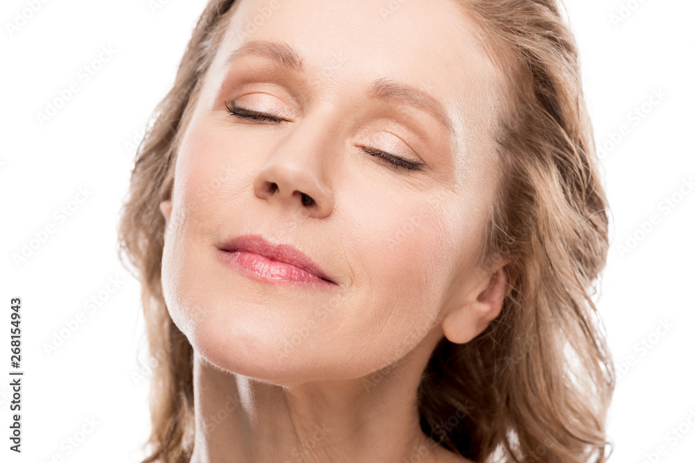 beautiful middle aged woman with clean face and eyes closed Isolated On White beautiful middle aged woman with clean face and eyes closed Isolated On White