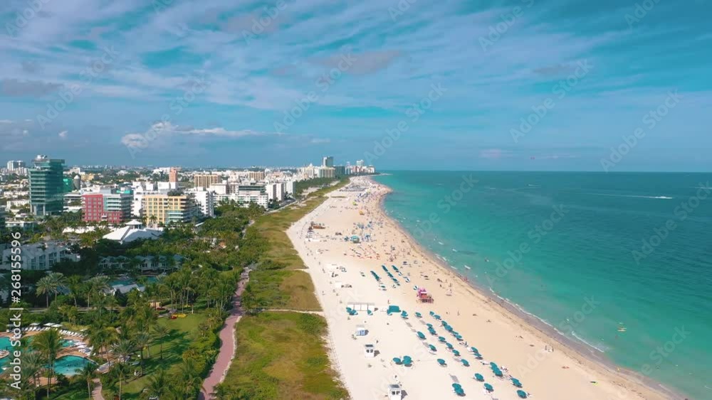 MIAMI, FLORIDA, USA - MAY 2019: Aerial drone panorama view flight over Miami beach. South Beach sand and sea from above. MIAMI, FLORIDA, USA - MAY 2019: Aerial drone panorama view flight over Miami beach. South Beach sand and sea from above.