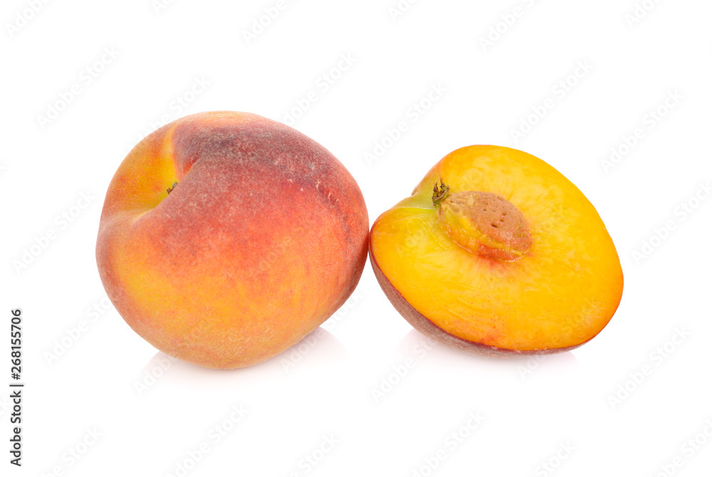 whole and half cut ripe peach on white background whole and half cut ripe peach on white background