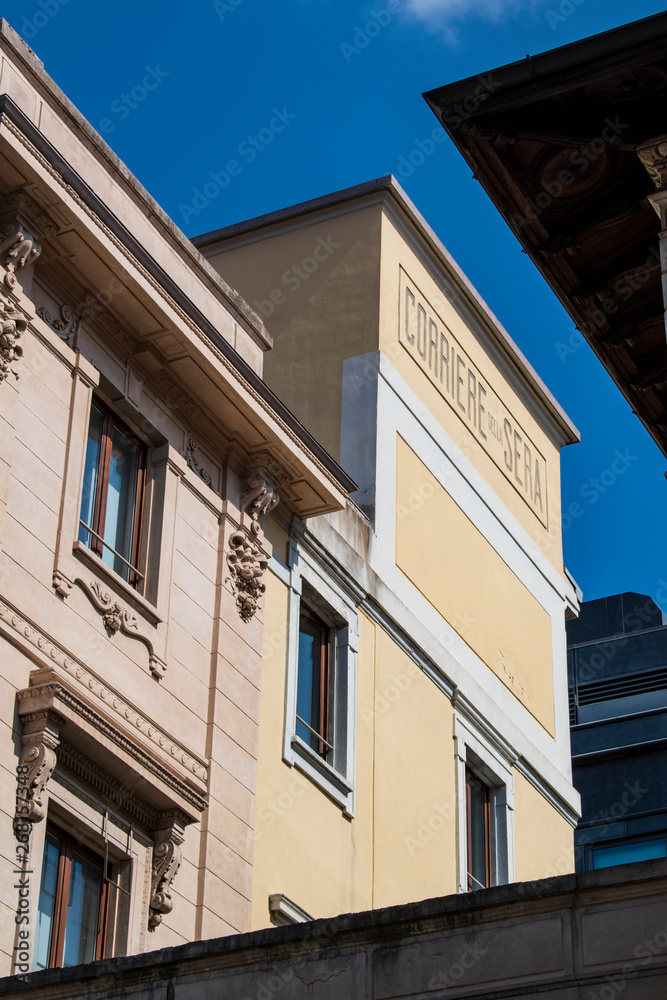 Milan, Italy, 03/28/2018: skyline of the city with the historic sign of Corriere della Sera, the most important Italian daily newspaper, founded in 1876, seen from via Solferino (Solferino Street) 