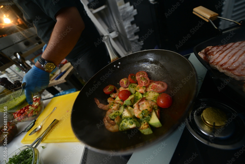 Making dinner at restaurant. Proffesional cooker Making dinner at restaurant. Proffesional cooker
