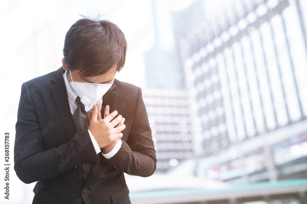 Portrait of man wearing facial hygienic mask nose outdoors. Ecology, air pollution car, Environmental and virus protection concept flu health against toxic dust covered the city of a health effect. Portrait of man wearing facial hygienic mask nose outdoors. Ecology, air pollution car, Environmental and virus protection concept flu health against toxic dust covered the city of a health effect.