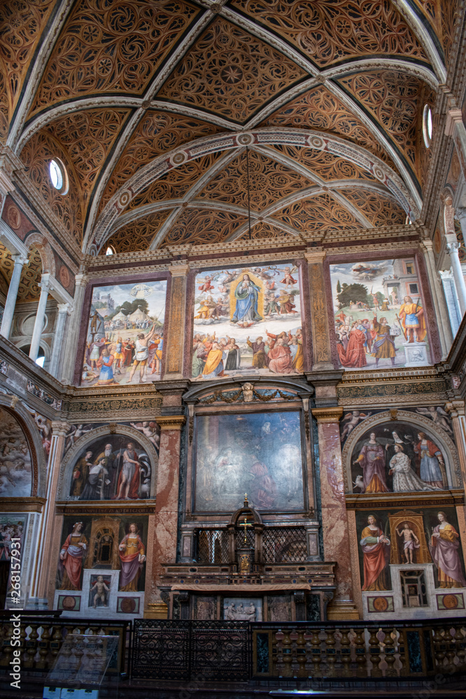 Fototapeta premium Italy, 03/28/2019: San Maurizio al Monastero Maggiore, 1518 church known as the Sistine Chapel of Milan, details of altarpiece and dividing wall in the faithful's area with frescoes by Aurelio Luini