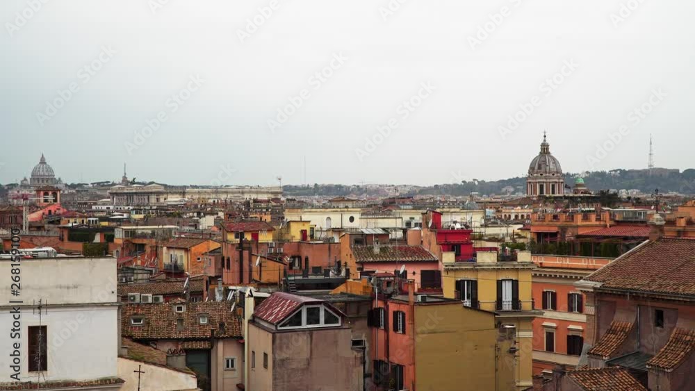 Panoramic city view of Rome, Italy on a cloudy day. Rome is full of authentic colourful buildings. Real time locked down shot. Rooftops view. Panoramic city view of Rome, Italy on a cloudy day. Rome is full of authentic colourful buildings. Real time locked down shot. Rooftops view.