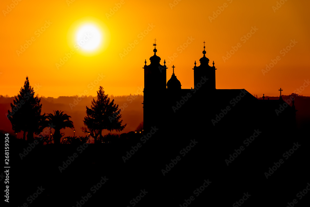 Silhouette view of a religious catholic Cathedral on top at the village