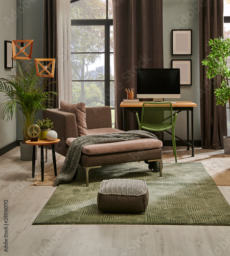 Fotografie Modern living room with grey sofa and frame, green wall close up decoration in front of the window