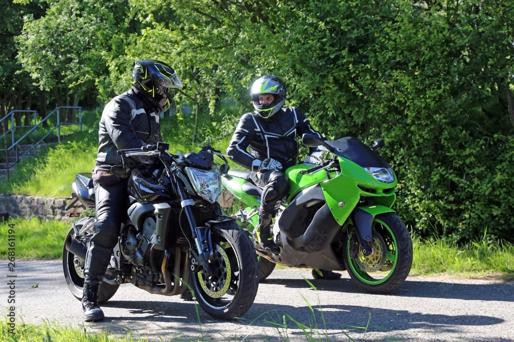 Two motorcyclists with a short interstop Two motorcyclists with a short interstop