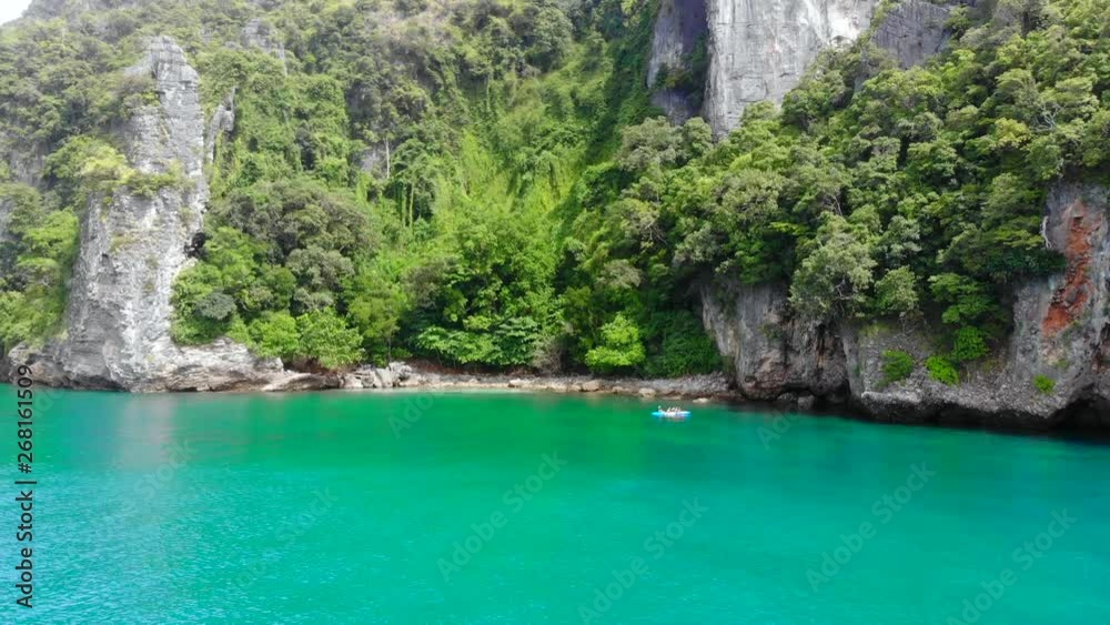 4k aerial view of people kayaking at tropical island in Thailand 4k aerial view of people kayaking at tropical island in Thailand
