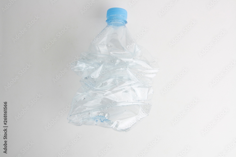 Empty plastic water bottle scaled for recycling