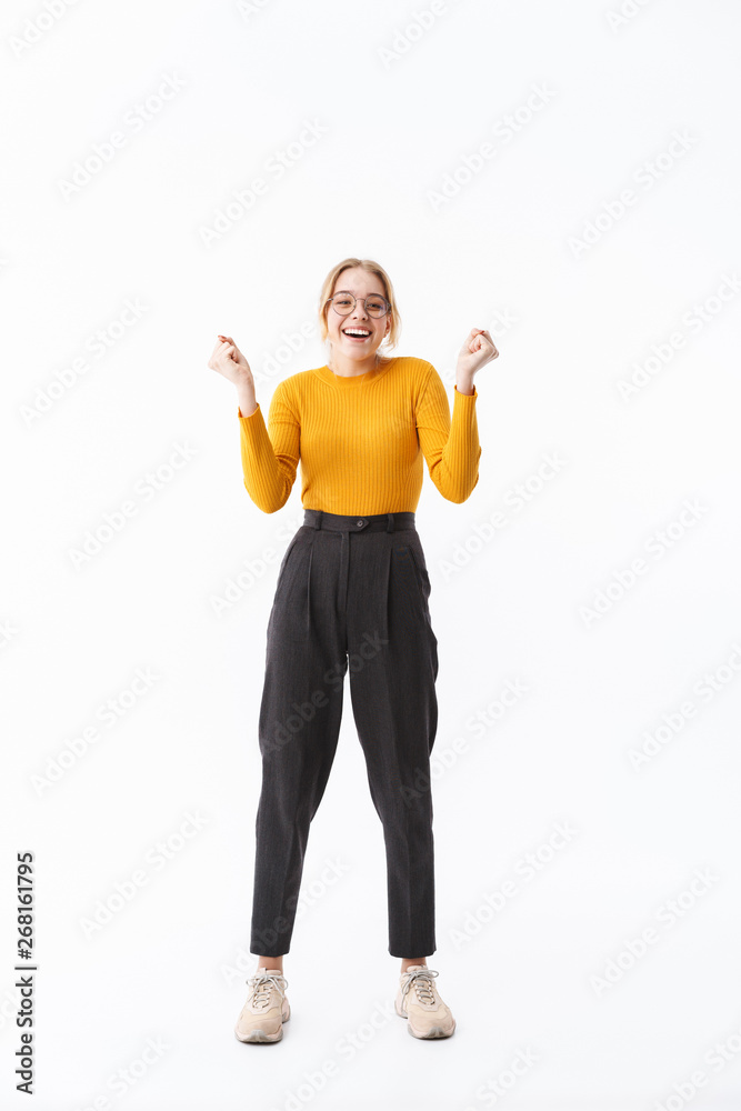 Full length of a smiling attractive young blonde woman