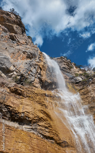 Beautiful waterfall with cloudy sky landscape. Uchan su waterfall in Yalta, Crimea, Russia.